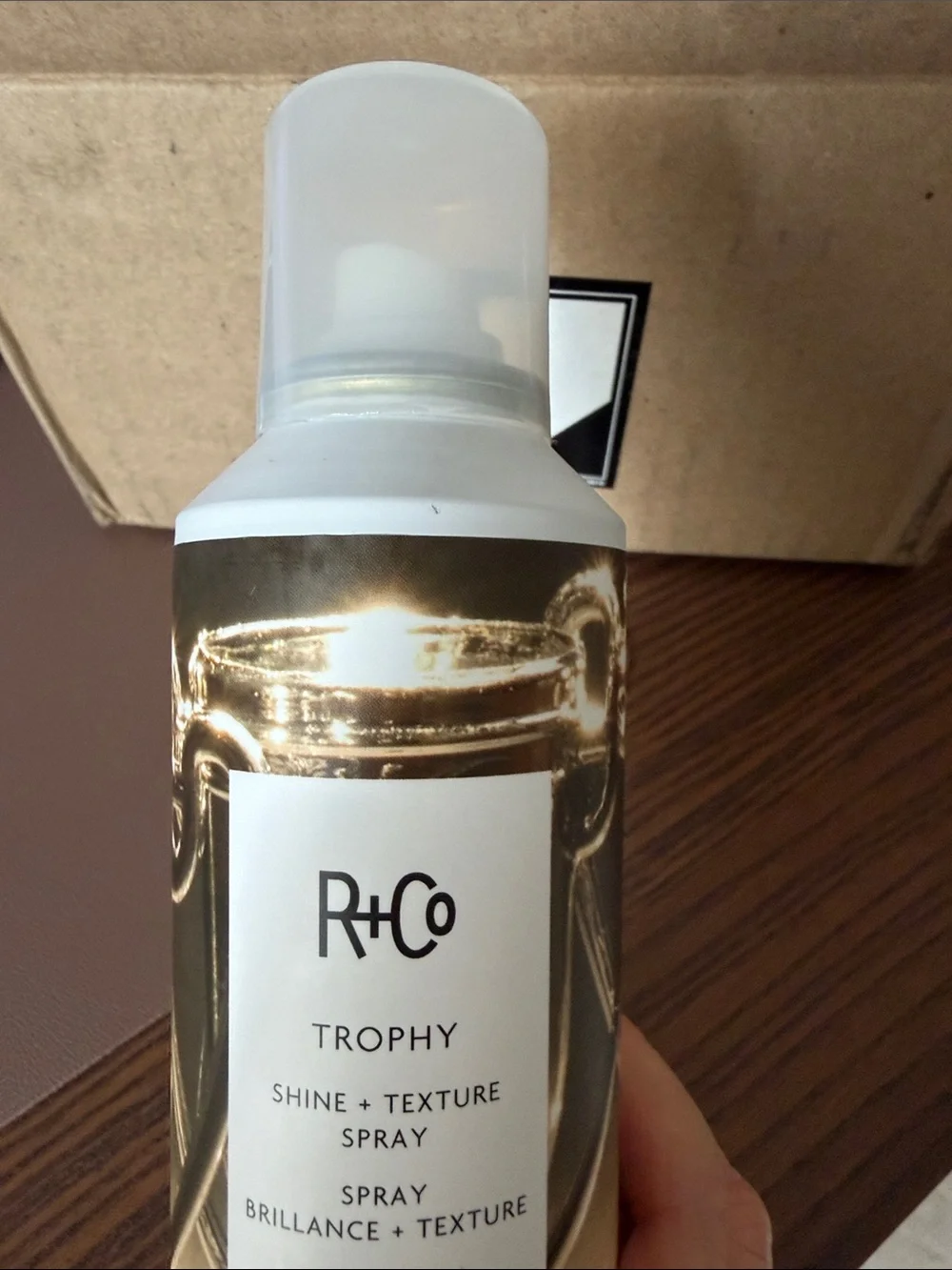 R+Co Trophy Shine & Texture Spray — Gold Bottle Accents